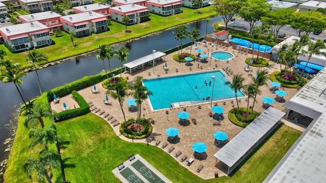 birds eye view of property featuring a water view