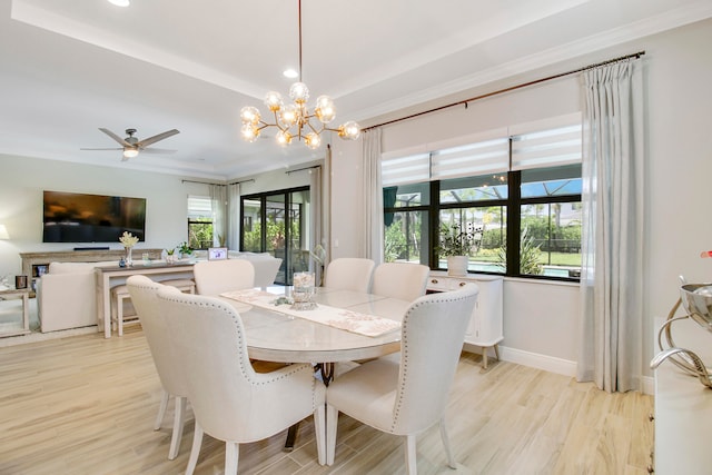 dining room with ceiling fan with notable chandelier and light wood-type flooring