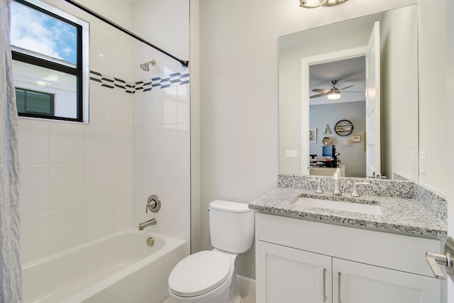 full bathroom with vanity, toilet, shower / tub combo, and ceiling fan