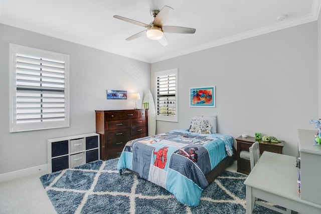 bedroom with ceiling fan, carpet, and crown molding