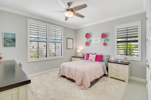 carpeted bedroom featuring crown molding, multiple windows, and ceiling fan