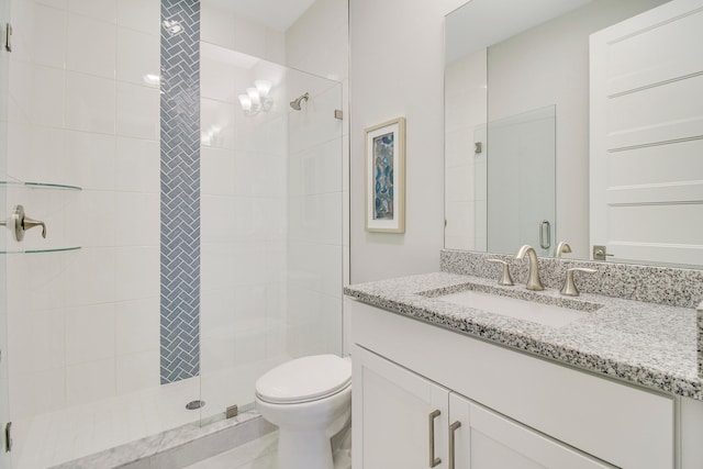 bathroom with an enclosed shower, toilet, and vanity