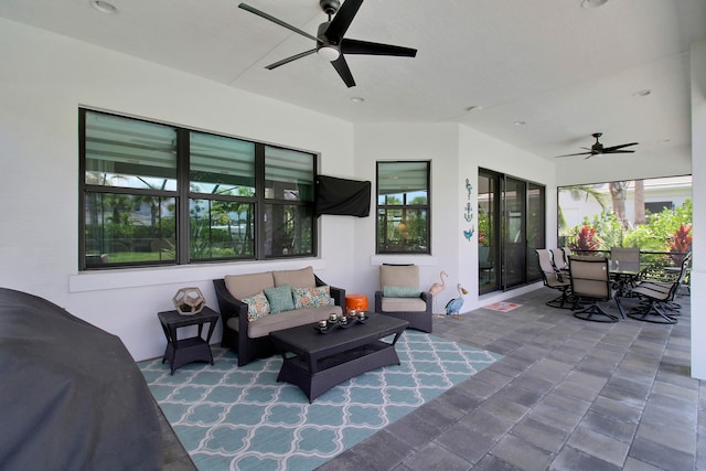 view of patio featuring outdoor lounge area and ceiling fan