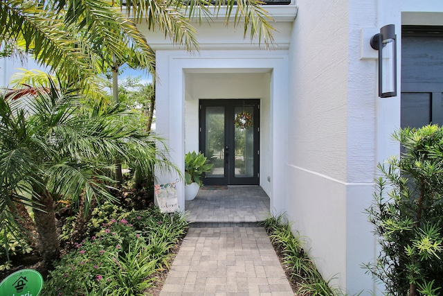 view of exterior entry featuring french doors