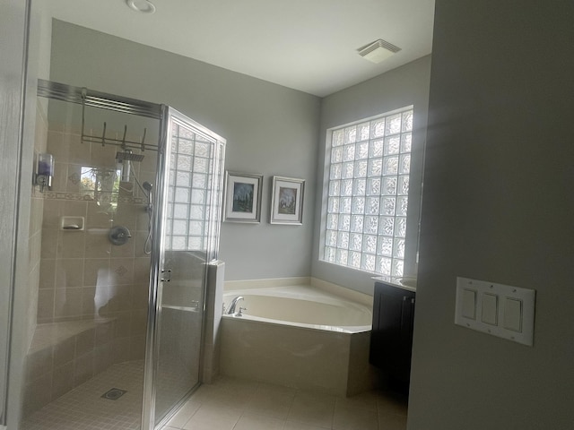 full bath with a bath, a stall shower, a healthy amount of sunlight, and visible vents
