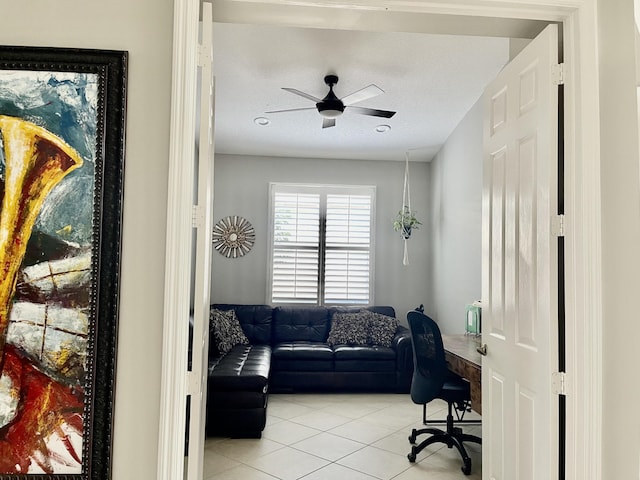 office area featuring light tile patterned flooring and ceiling fan
