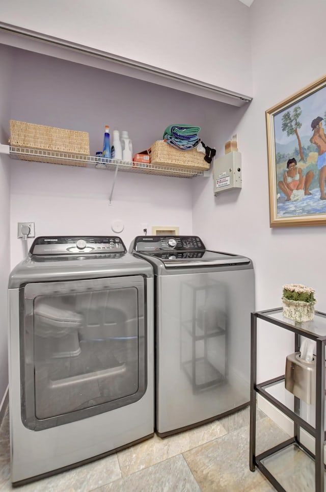 washroom with independent washer and dryer