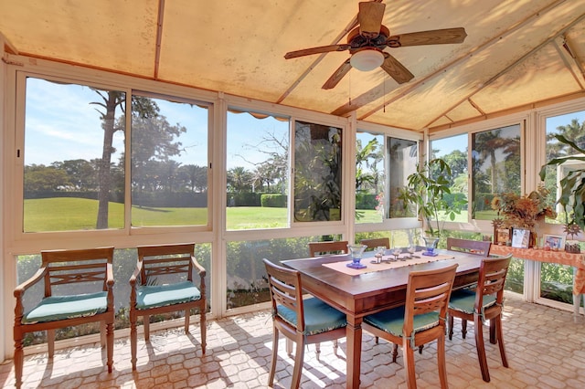 sunroom featuring ceiling fan