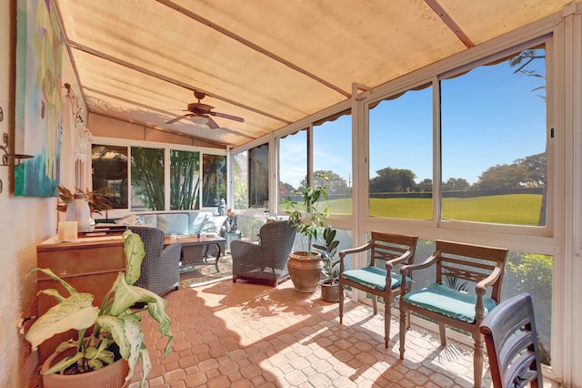 sunroom / solarium with vaulted ceiling and ceiling fan