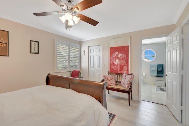 bedroom with crown molding, ceiling fan, light wood-type flooring, connected bathroom, and a closet