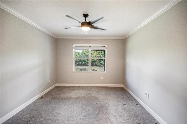 empty room with ceiling fan and crown molding