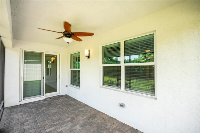 view of patio / terrace featuring ceiling fan