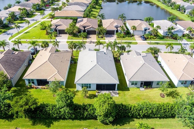 aerial view with a water view and a residential view