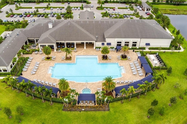 view of pool featuring a water view