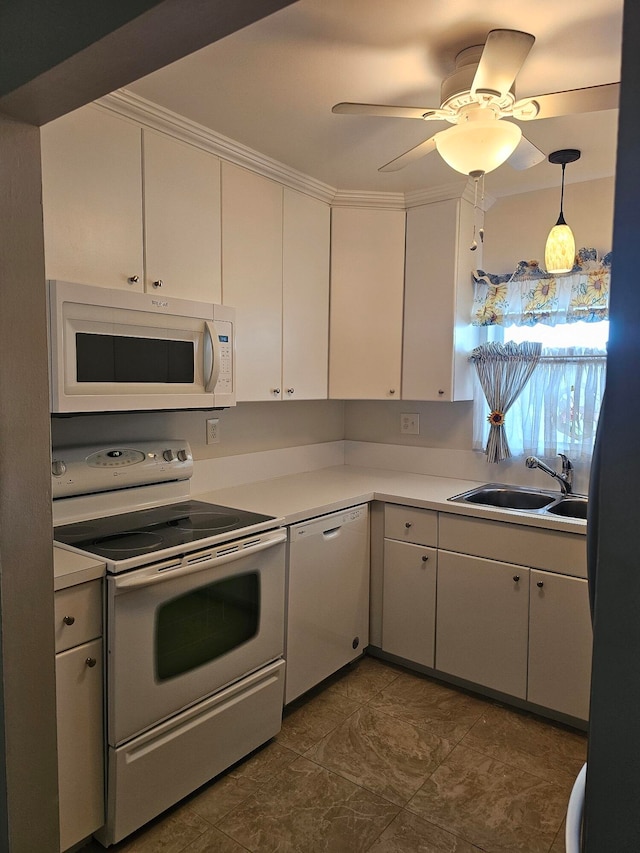 kitchen featuring white cabinetry, ceiling fan, pendant lighting, white appliances, and sink