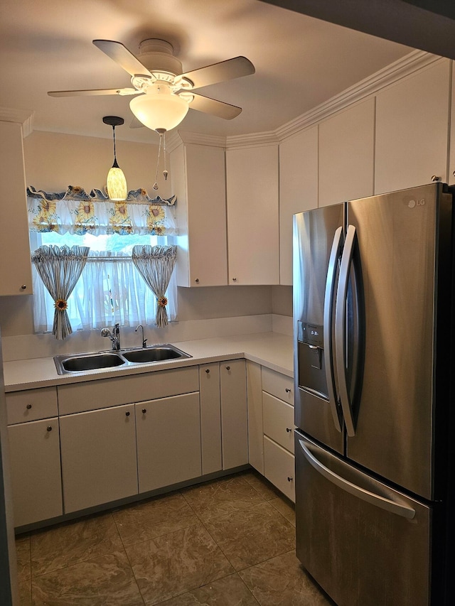 kitchen with tile patterned floors, ceiling fan, pendant lighting, stainless steel fridge with ice dispenser, and sink