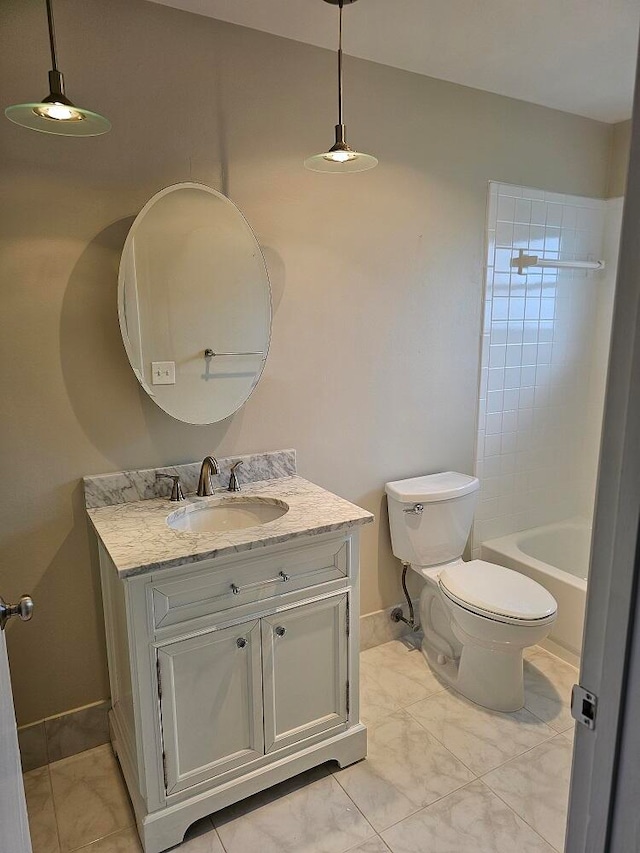 full bathroom featuring vanity, tile patterned flooring, tiled shower / bath, and toilet