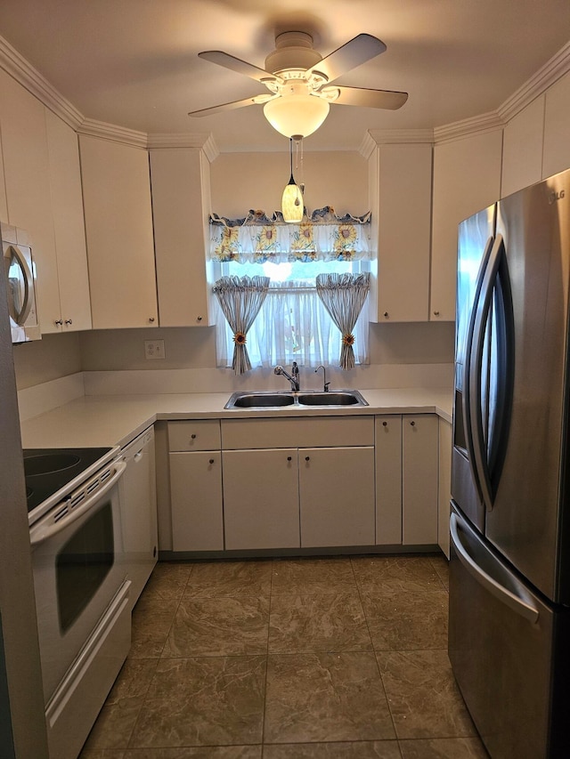 kitchen with sink, ceiling fan, white cabinets, and stainless steel appliances