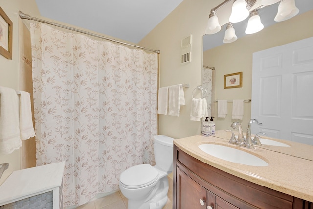 bathroom featuring vanity, toilet, and tile patterned floors