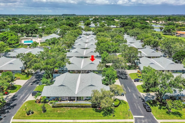 birds eye view of property with a residential view and a water view