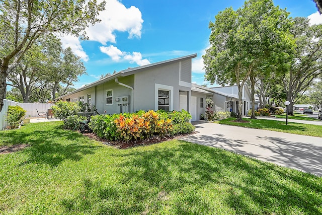 view of side of home with a lawn