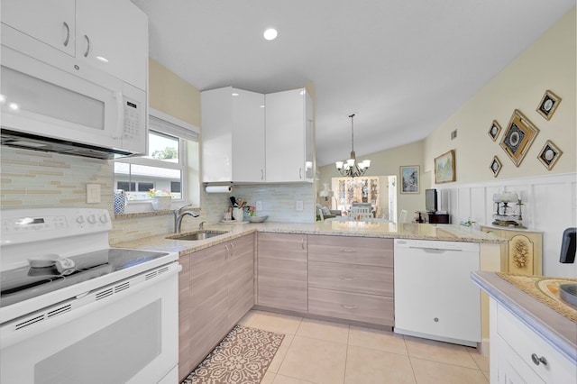 kitchen featuring a notable chandelier, decorative backsplash, white cabinets, white appliances, and kitchen peninsula