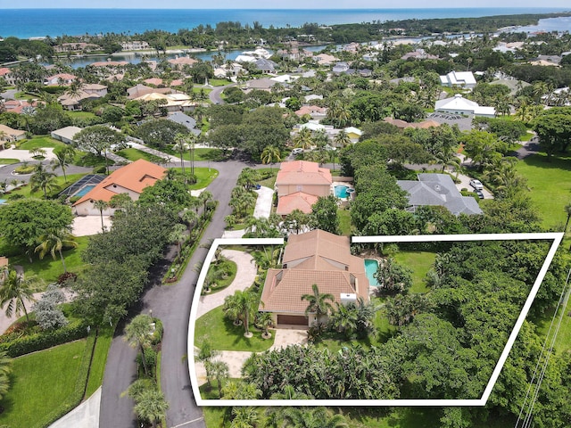 birds eye view of property featuring a water view