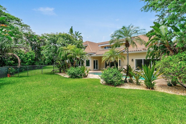 view of yard with a fenced in pool