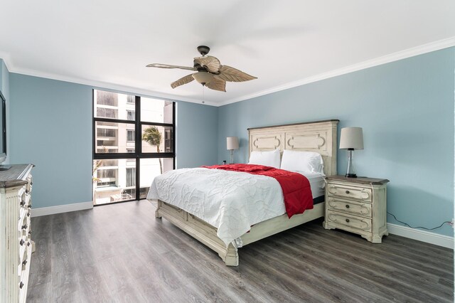 bedroom featuring ornamental molding, ceiling fan, and dark wood-type flooring