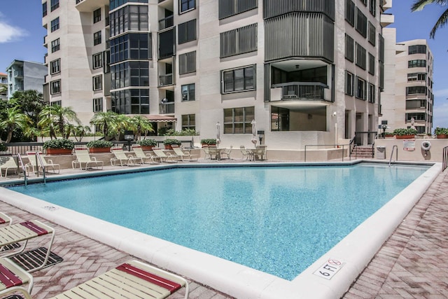 view of swimming pool with a patio