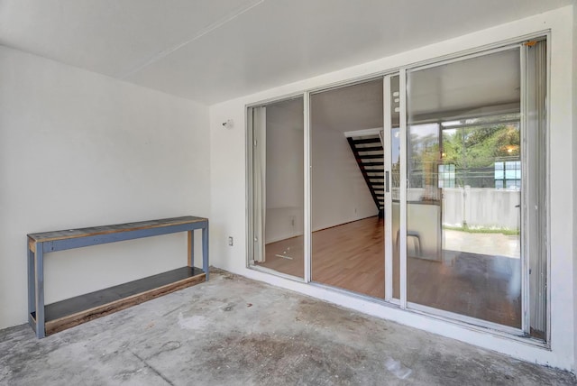 unfurnished bedroom with two closets and wood-type flooring