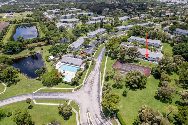 birds eye view of property with a water view and a residential view