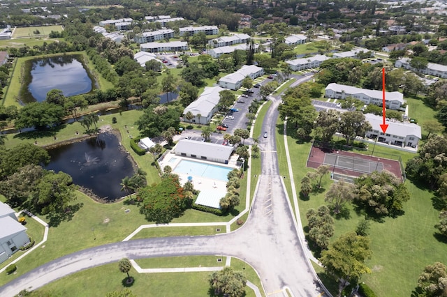 birds eye view of property featuring a water view