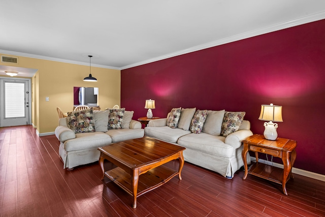 living room with crown molding and dark wood-type flooring