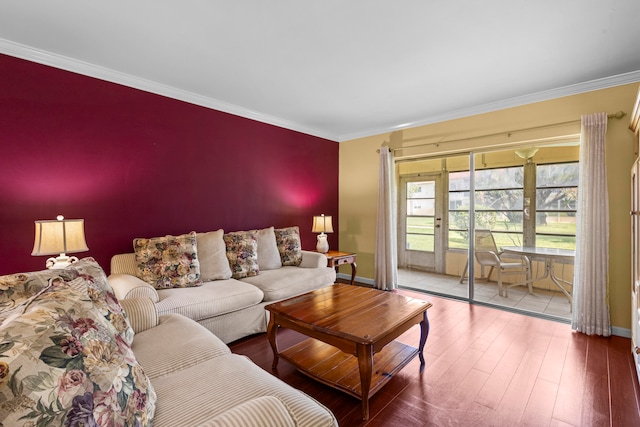 living room with hardwood / wood-style flooring and ornamental molding