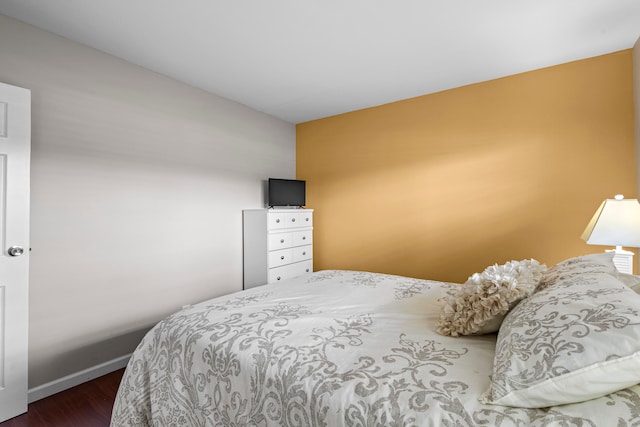 bedroom featuring dark hardwood / wood-style flooring