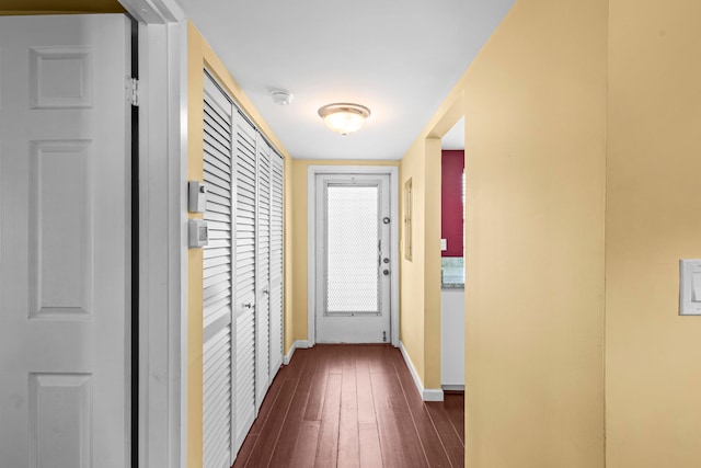 entryway with dark hardwood / wood-style floors