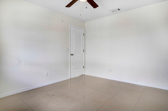 unfurnished room featuring ceiling fan and light tile patterned flooring