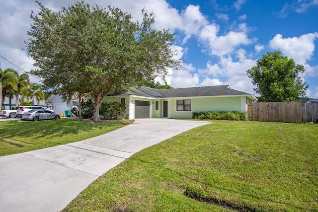 ranch-style house featuring a front yard and a garage