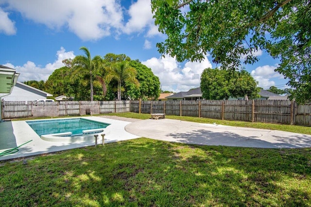 view of swimming pool featuring a patio area and a yard