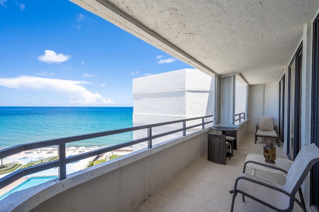 balcony featuring a water view