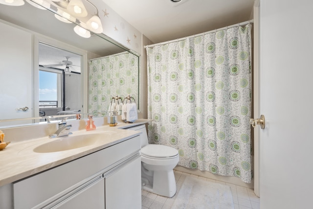 bathroom with vanity, ceiling fan, toilet, and tile patterned floors