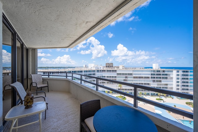 balcony featuring a water view