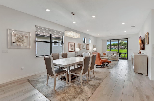 dining area with light hardwood / wood-style flooring