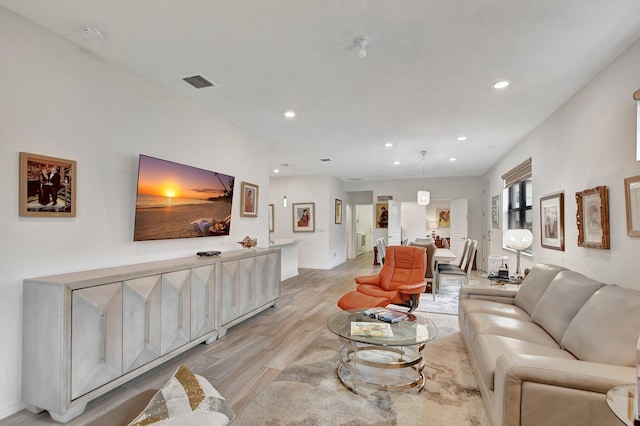 living room with light hardwood / wood-style flooring