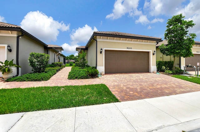 mediterranean / spanish-style house featuring a garage