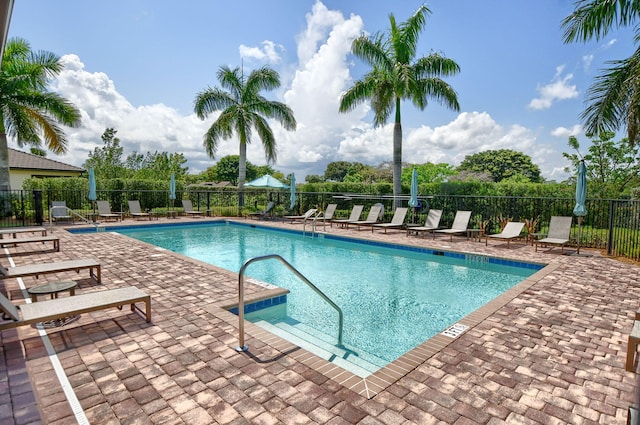 view of swimming pool with a patio