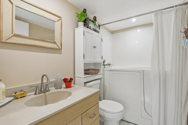 bathroom featuring vanity, toilet, and curtained shower