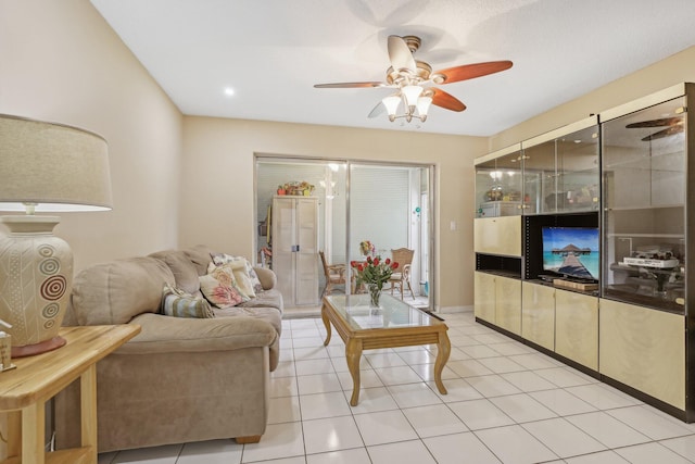 tiled living room featuring french doors and ceiling fan