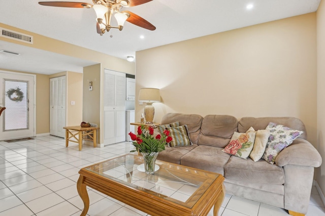 tiled living room featuring ceiling fan